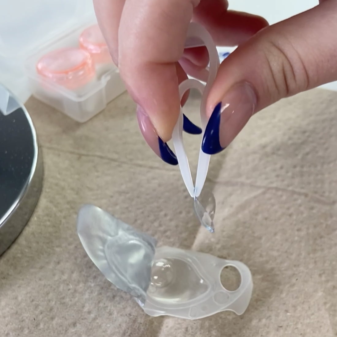 Teaching contact lens use.Remove contact lenses from storage solution